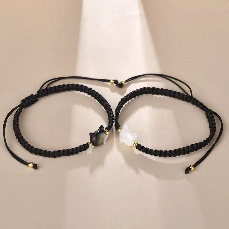 Hand-woven couple's bracelet with a cat-face design