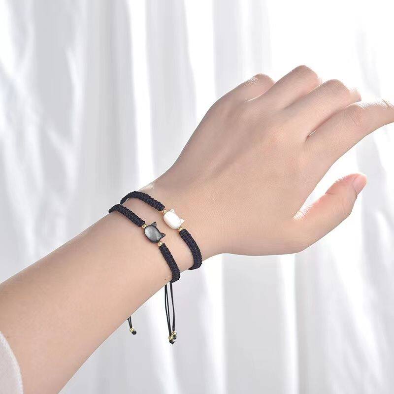 Hand-woven couple's bracelet with a cat-face design