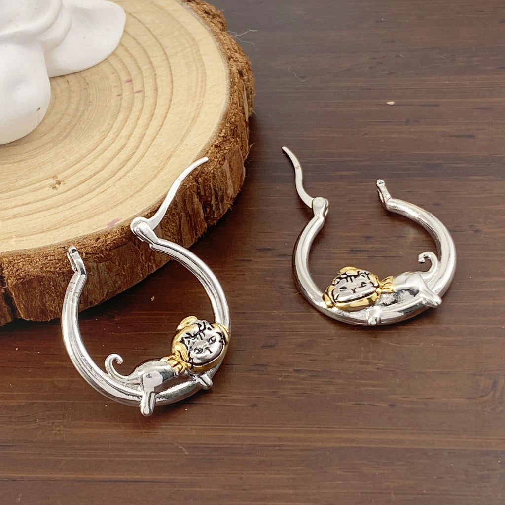 Stylish round cat-themed earrings