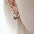 Stylish round cat-themed earrings