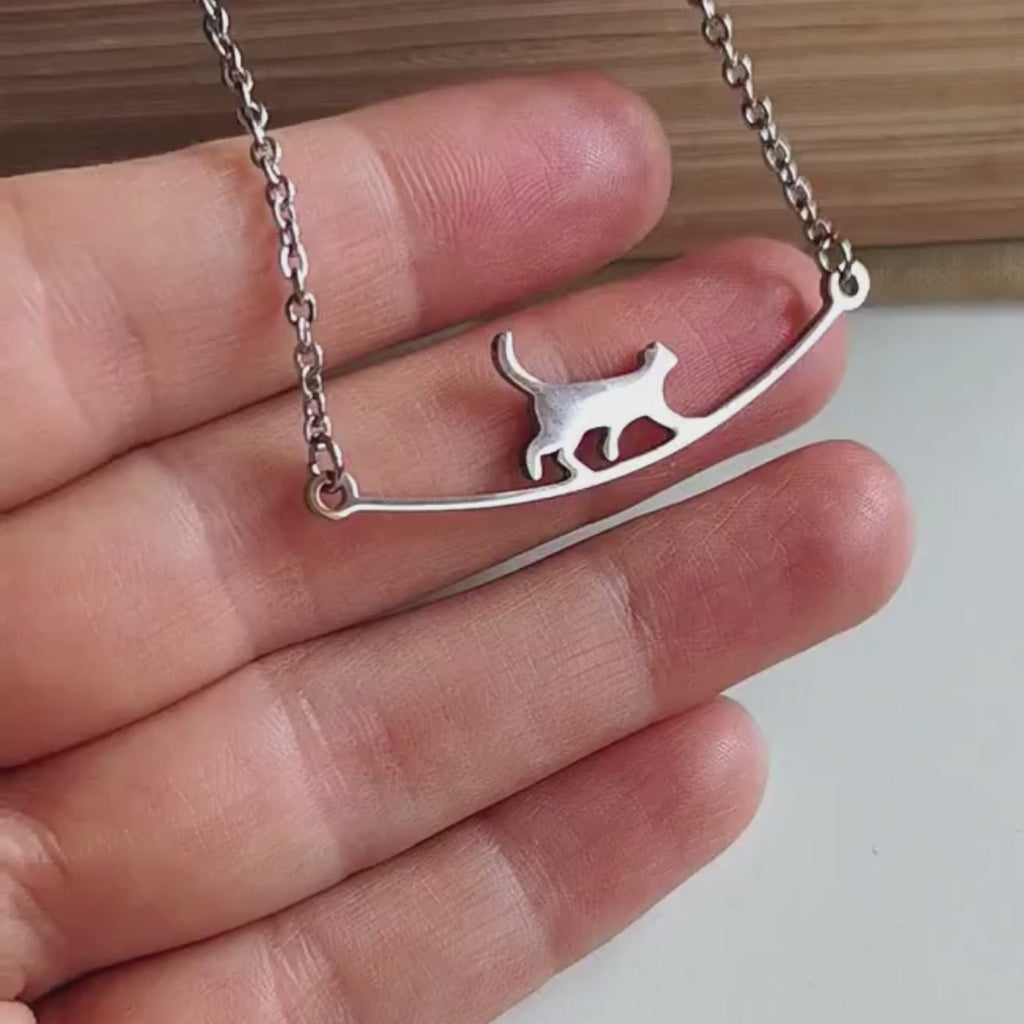 S925 silver necklace with a unique curved cat-shaped pendant.